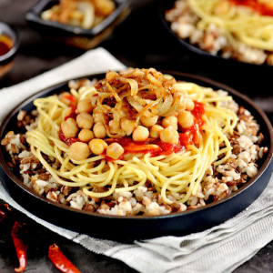 Koshary El Tahrir, Egyptian food made with a mixture of toasted pasta, rice, lentils, chickpeas and fried onions