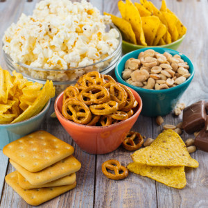 Best Snack food - Biscuits, bowl of pretzels, popcorn and chocolate