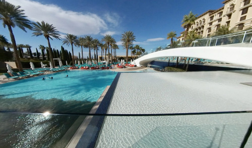 Las Vegas Palm trees & pool side beds surround the huge pool area of an upscale casino resort - Green Valley Ranch Resort Spa - Henderson, Nevada