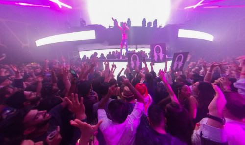 Huge crowd of party goers dancing to the DJ's performance in Hakkasan Nightclub, Las Vegas