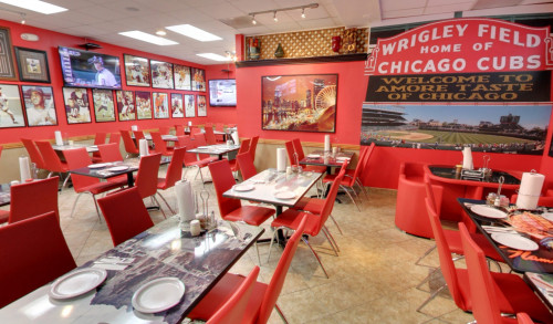 Row of tables and chairs inside Amore Taste of Chicago - pizza restaurant in Las Vegas