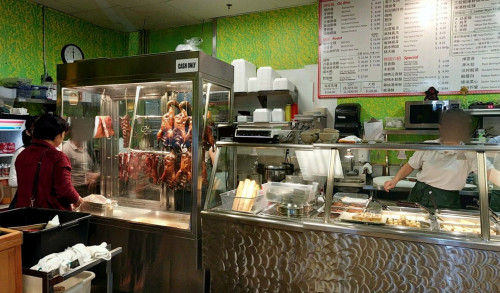 A customer ordering a Peking Duck in Asian BBQ & Noodle - Chinese restaurant in Las Vegas, NV