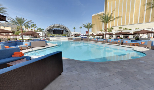 Cabanas surrounding the pool of DAYLIGHT Beach Club, Las Vegas with the DJ Booth at the center