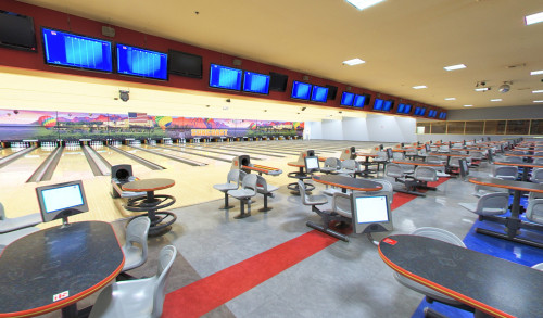 Bowling alleys & neatly aligned chairs & tables of Suncoast Bowling Center in Las Vegas, NV
