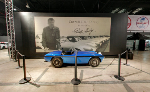 Photo of Carroll Shelby (the founder of Shelby American Inc) as a backdrop to a blue colored vintage car display in Carroll Shelby Museum in Las Vegas