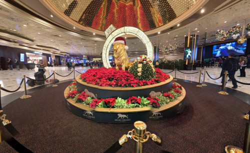 The gold lion statue placed in the center of MGM Grand Hotel lobby in Las Vegas with Christmast decorations