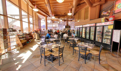 Las Vegas Dining tables & chairs aligned in front of the rows of beverage & snack coolers in Boulder City, Nevada's Hoover Dam Cafe - selling American fastfood & some souvenir items