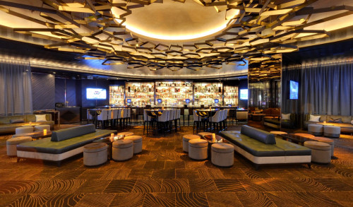 Modern and high-end interiors of Clique Bar and Lounge in Vegas with stylish decorations & seats