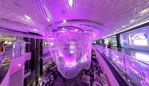 Las Vegas The view of the giant, crystal, thread-like chandelier from the second floor of The Chandelier bar & lounge in Vegas, with its purple lights shining all over place