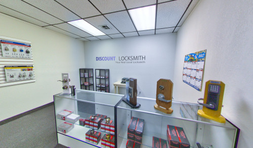 Las Vegas Padlocks hanging on the left side wall while door handles, knobs & electronic door locks placed on top of a glass cabinet inside Discount Locksmith - emergency locksmith service in Vegas