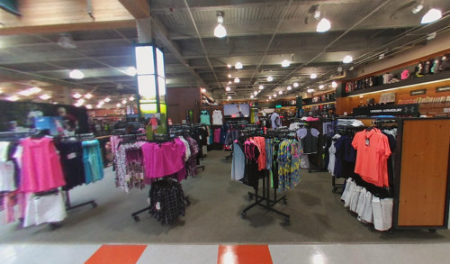 Displays of athletic clothes and footwear in the women's apparel section at DICKS Sporting Goods shop in Las Vegas, NV
