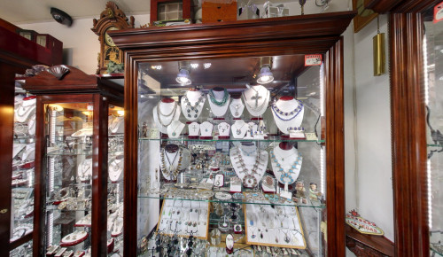 Las Vegas Eyeglasses stand full of sunglasses displayed in front of Oro and Jewelers shop in Boulder City, Nevada
