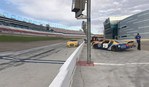 Las Vegas NASCAR vehicles parked on the other side of the race track for Richard Petty Driving Experience in Vegas